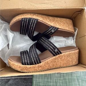 Women's Black and Tan Wedge Skechers Sandals